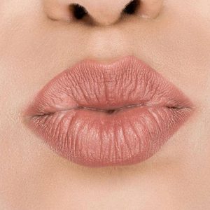 Raww - Coconut Kiss Lipstick in the shade of Angelic Almond with a closeup image applied to a woman's puckered lips