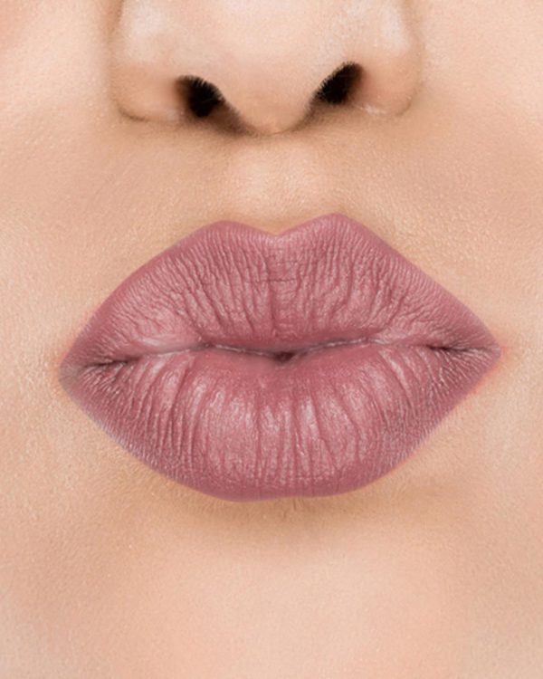 Raww - Coconut Kiss Lipstick in the shade of Fancy Fig with a closeup image applied to a woman's puckered lips