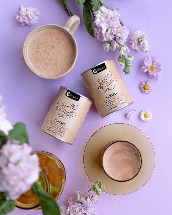 Nutra Organics Lovers Latte styled image with flowers on a lavender background