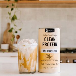 Nutra Organics Clean Protein Salted Caramel Fudge Flavour Smoothie with product container on a kitchen table