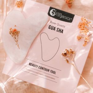 Nutra Organics Rose Quartz Gua Sha Beauty Contour Tool and packaging in a styled image