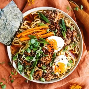 Top view of a bowl of delicious vegetables, herbs, and eggs made with Nutra Organics Beef Bone Broth in Miso Ramen Flavour